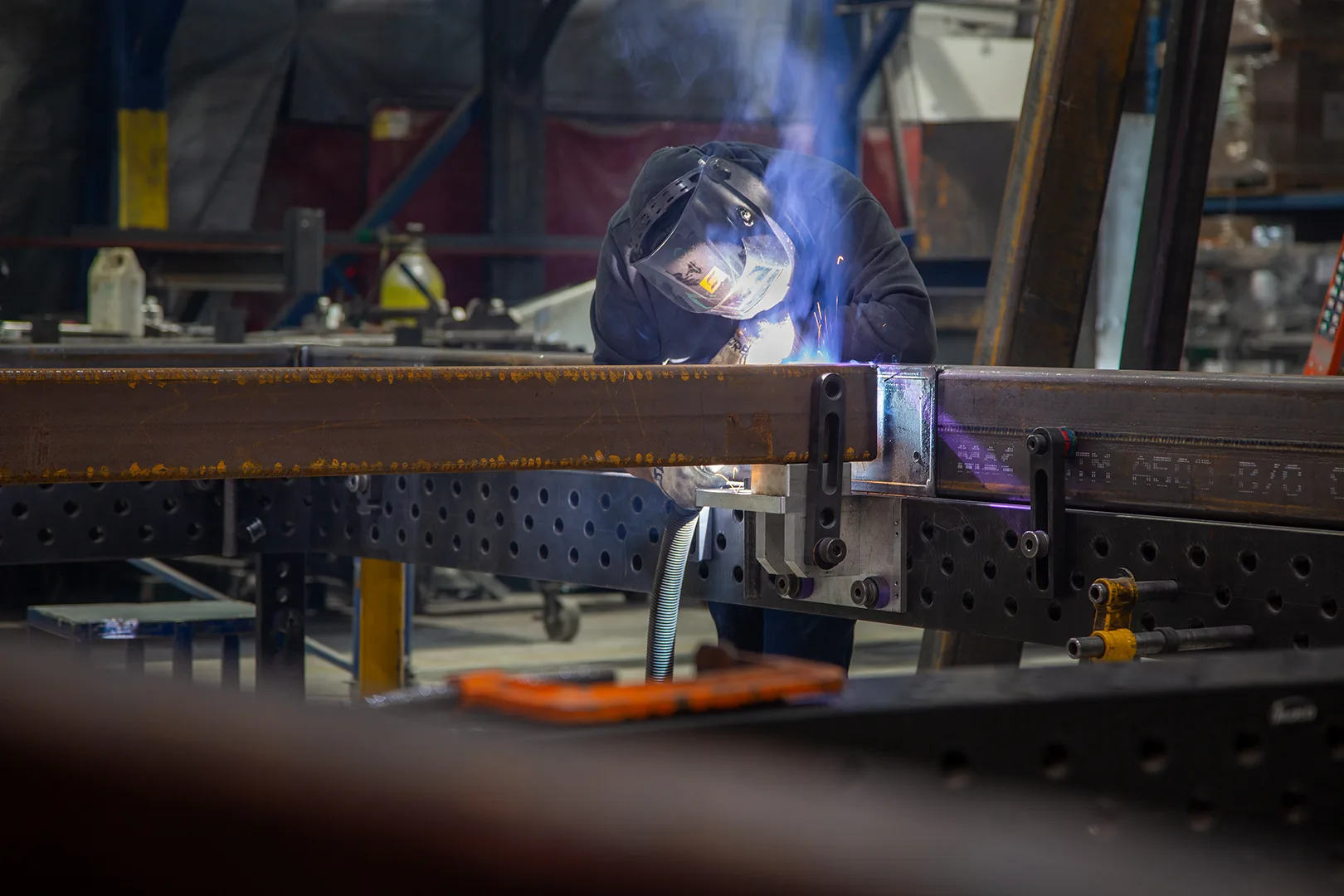 Welder joining a steel module corner